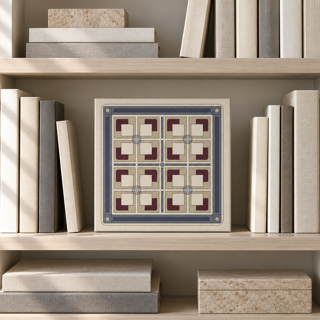 A square decorative tile or art print featuring a geometric pattern in cream, slate blue, and burgundy, displayed on a light wood bookshelf between books.