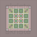 A square decorative tile or rug design shown from above on a plain taupe background. The pattern consists of a pink border and a central grid of geometric motifs in green, yellow, lavender, and gray, with a faint repeated 'skriste' watermark across the image.