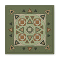 A square decorative mat or rug with a geometric tribal pattern in shades of olive green, tan, brown, and dark gray, shown flat against a white background.